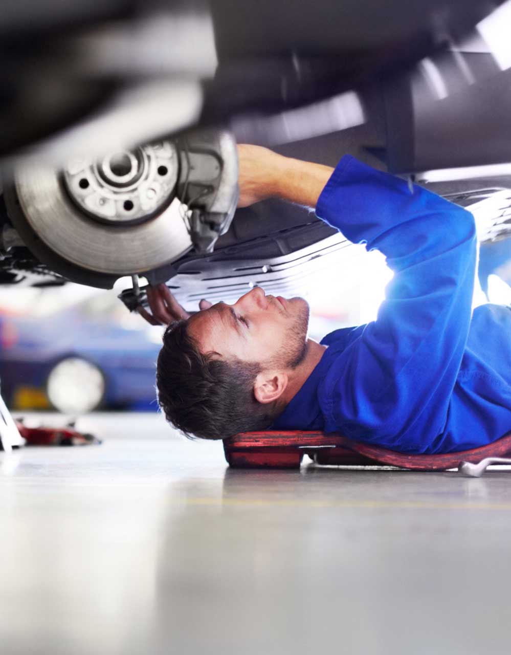 mechanic working under a car